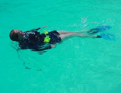 diver swimming on surface