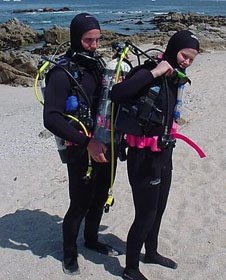 divers donning scuba units