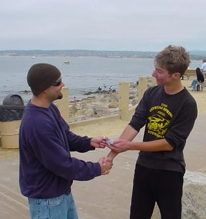 Instructor handing certification card to student