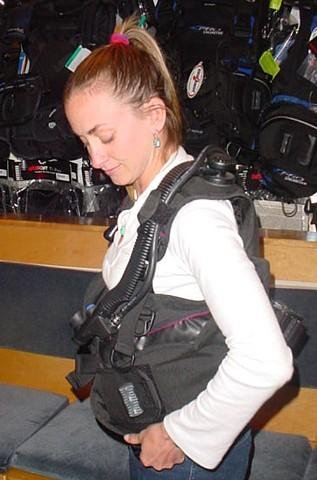 Diver checking fit of BCD