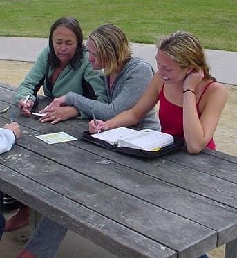 Divers filling out logbooks