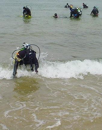 Diver existing through surf