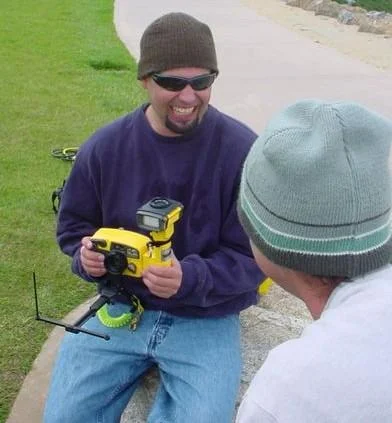 Instructor demonstrating how to use an underwater camera